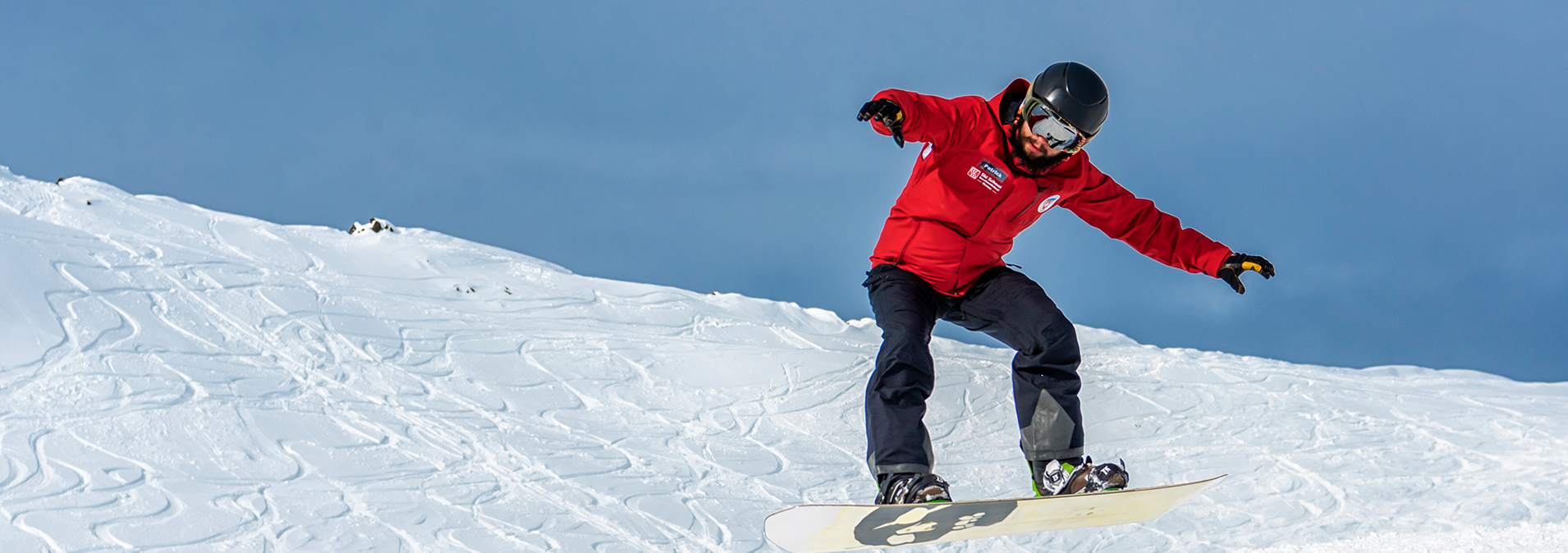 Snowboardlehrer beim Snowboarden in Klosters - Davos